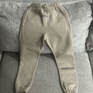 Kids Essentials fear of god sweatpants.